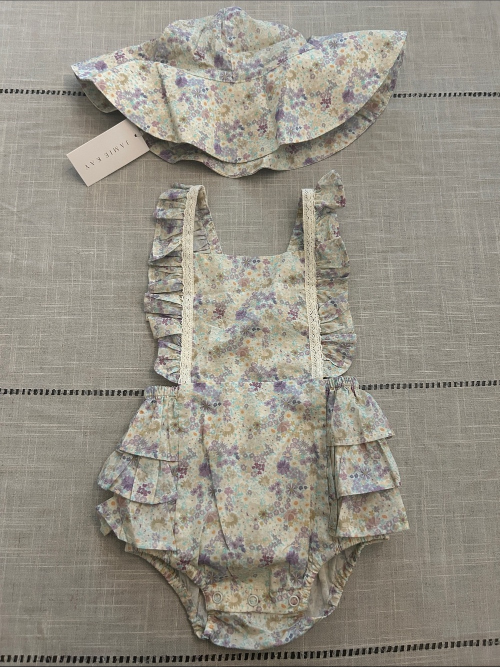 Jamie Kay Floral Ruffle One-Piece and Sun Hat in Pastel Lavender, Cream, Yellow
